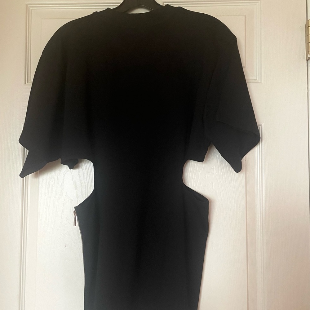 Black top with cut out sides. Size large. Never worn.Smoke free home.No pets. - Picture 2 of 3